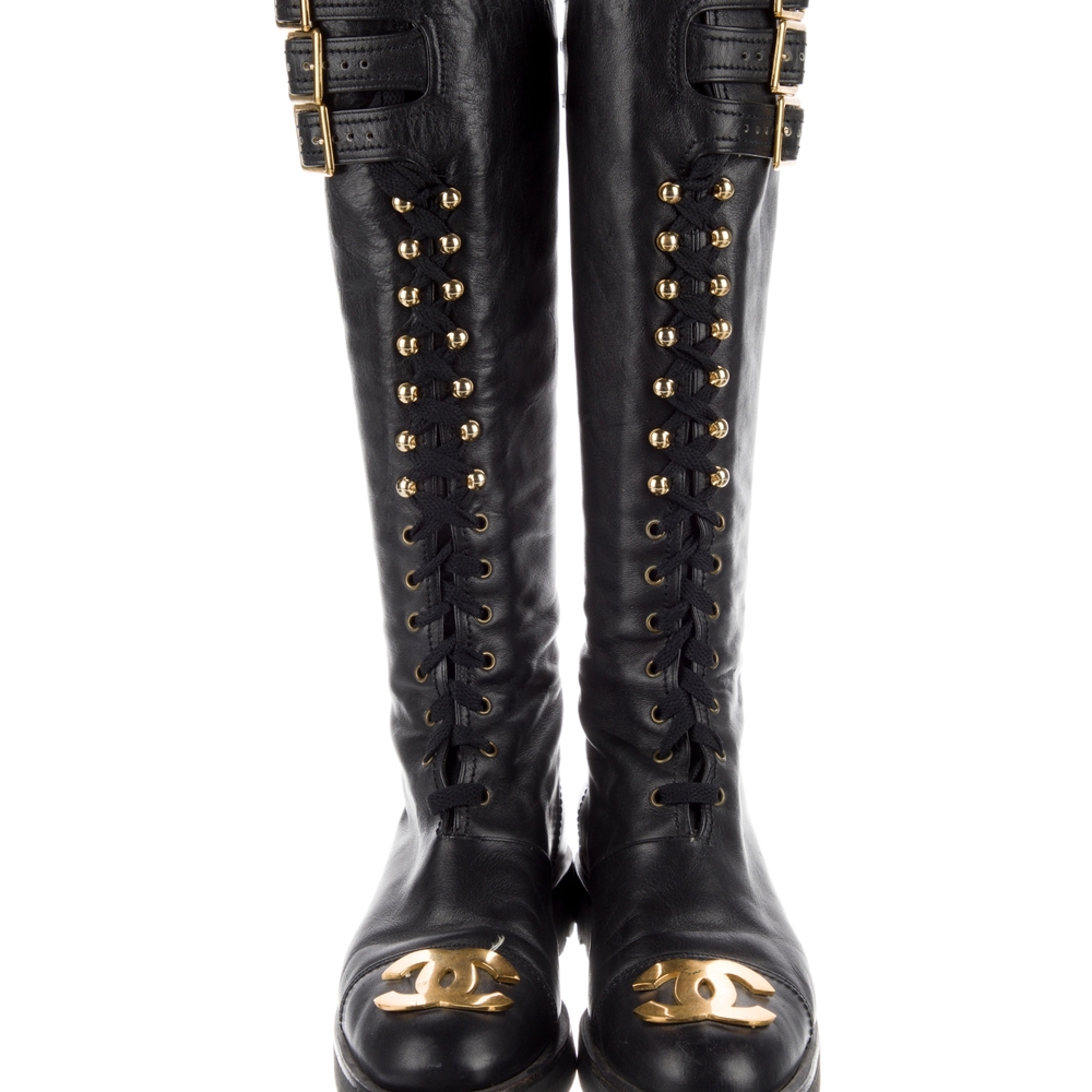 CHANEL Black Leather Knee-High Boots with Gold Accents